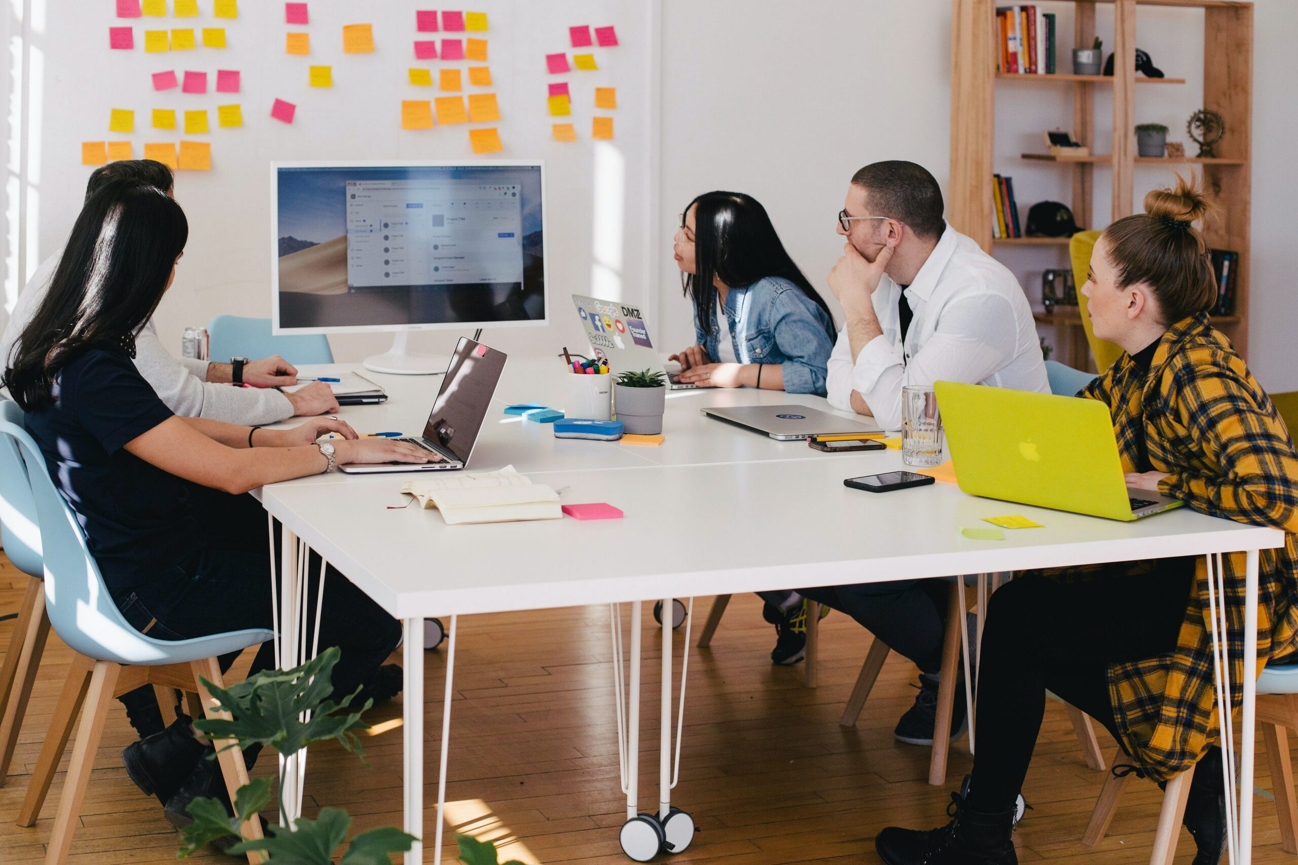 Colleagues from a PR agency collaborating in a modern office